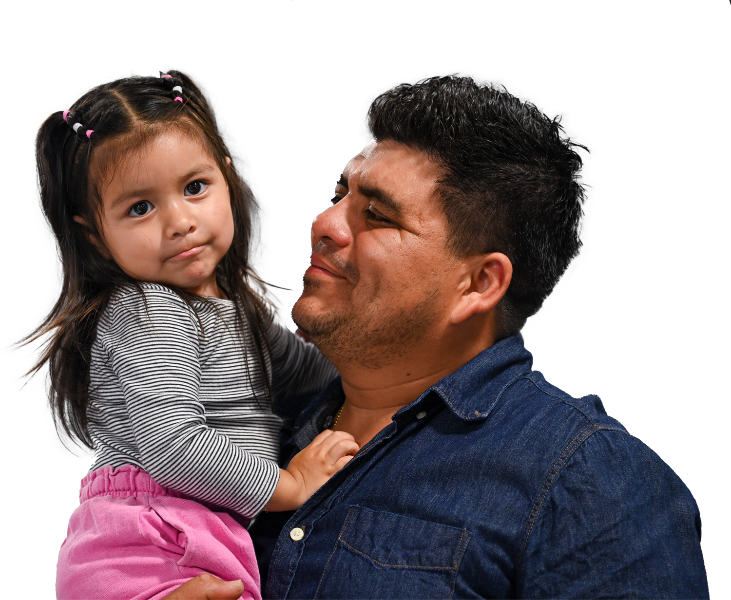 Dad smiling and holding his daughter. 