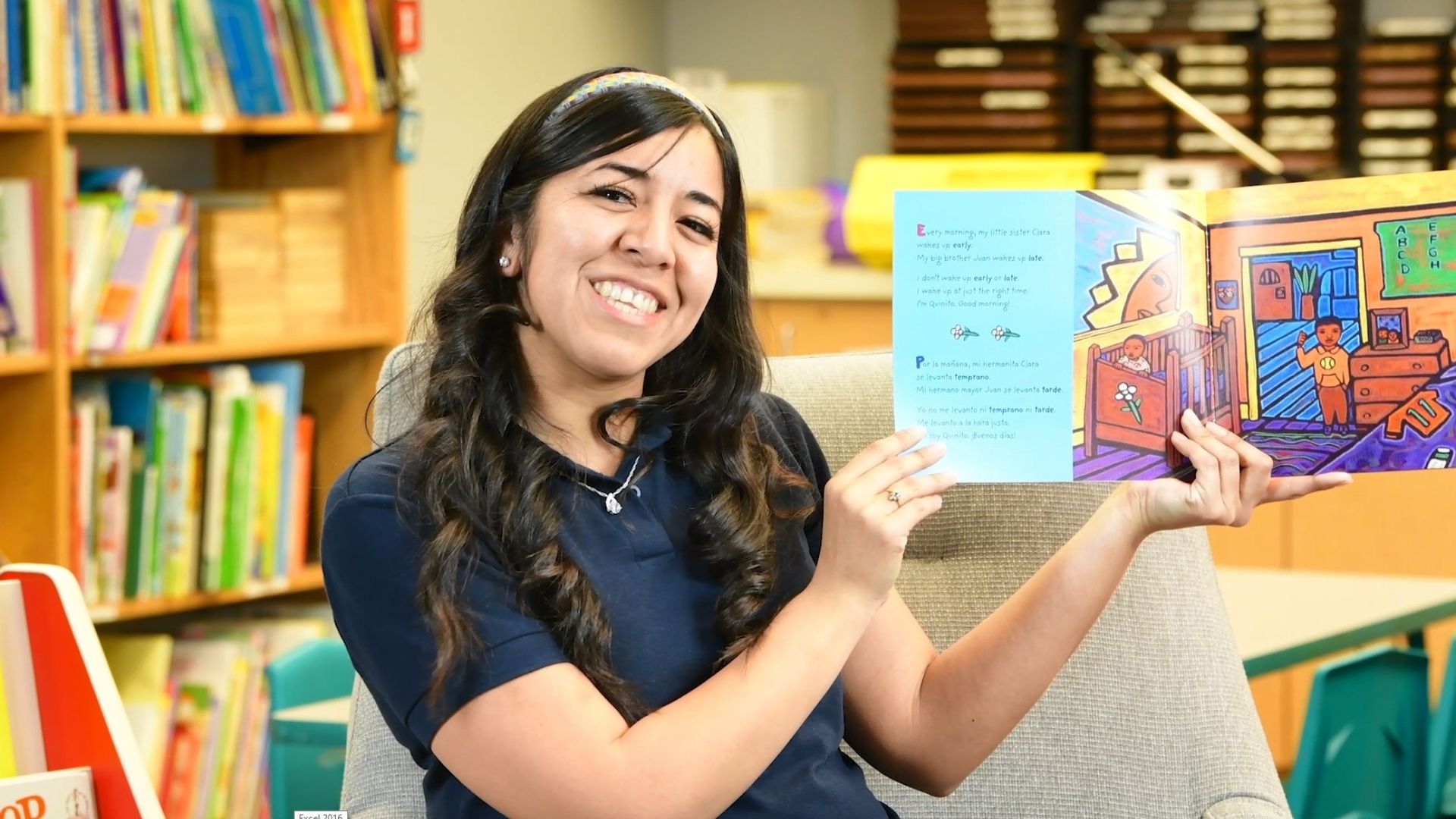 CCRC staff displaying a book for Story Time