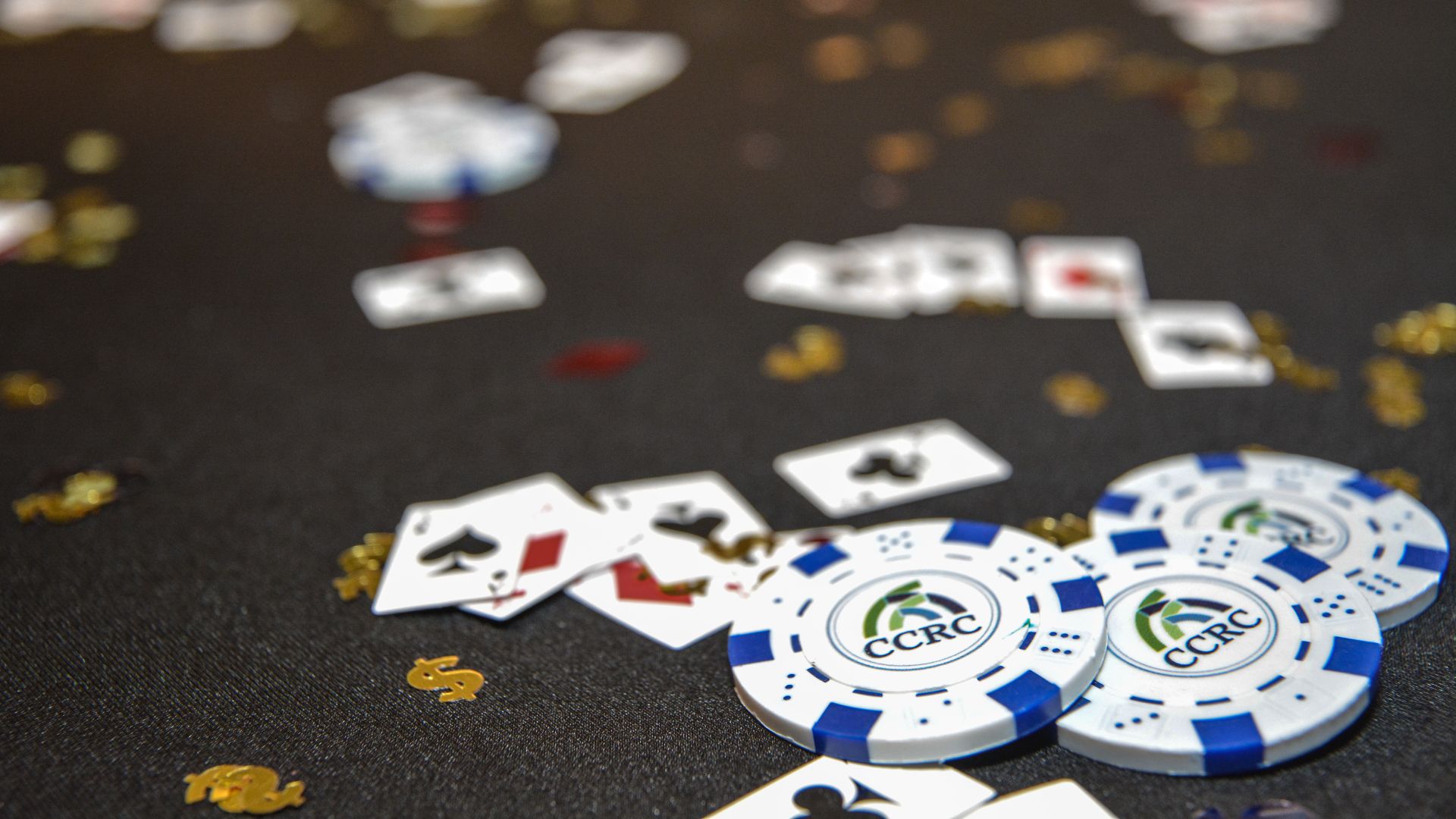 An image featuring poker chips with CCRC’s logo on a black tablecloth. Used as promotional artwork for Poker Tournament fundraiser.