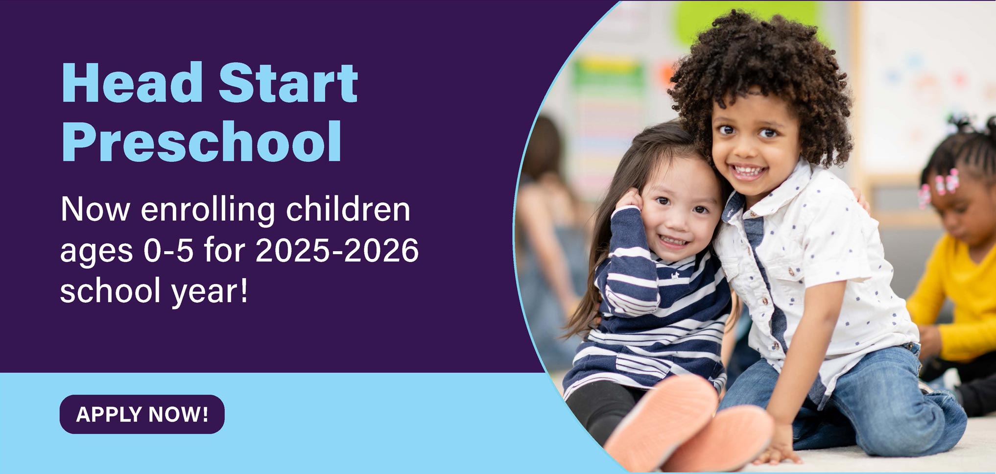 Two children smiling in a classroom