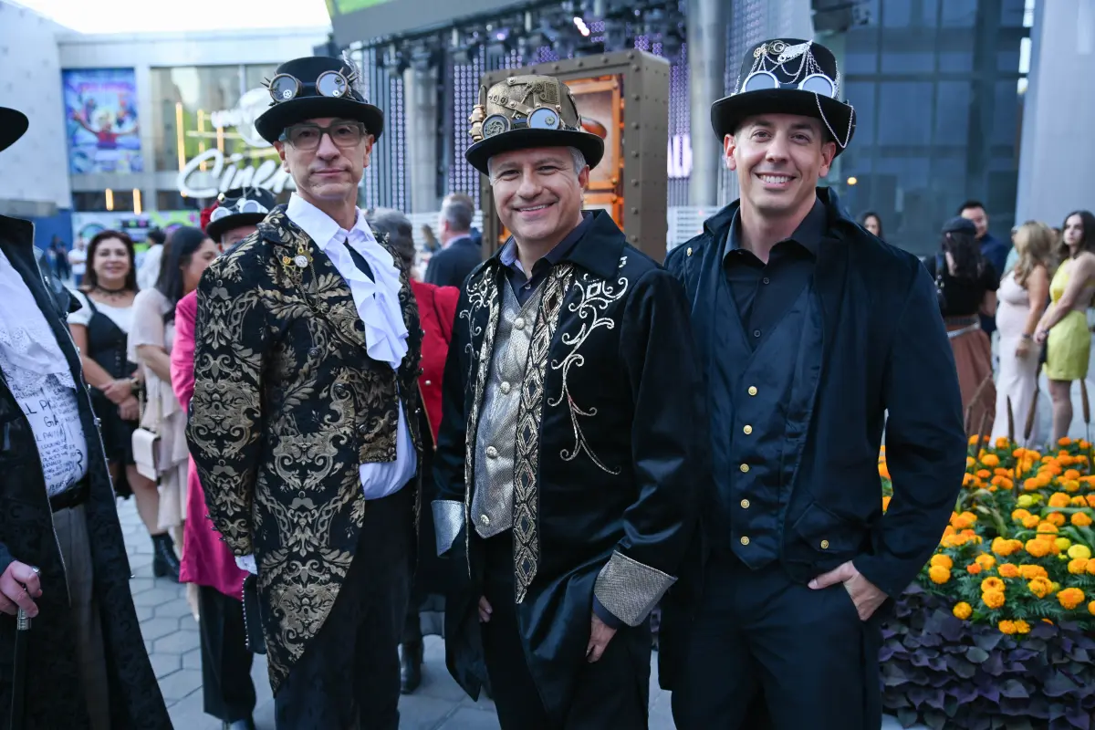 3 men dressed in steampunk costumes smiling